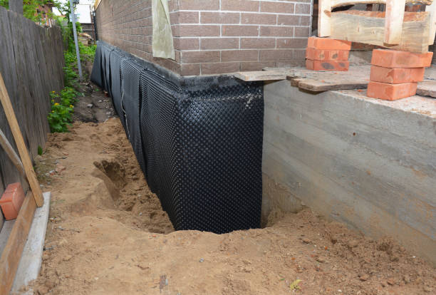 Happy homeowners after waterproofing job in Union Pier